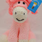 Pink pony stuffed toy with white nose and dark pink curly hair, unique baby gift for a toddler