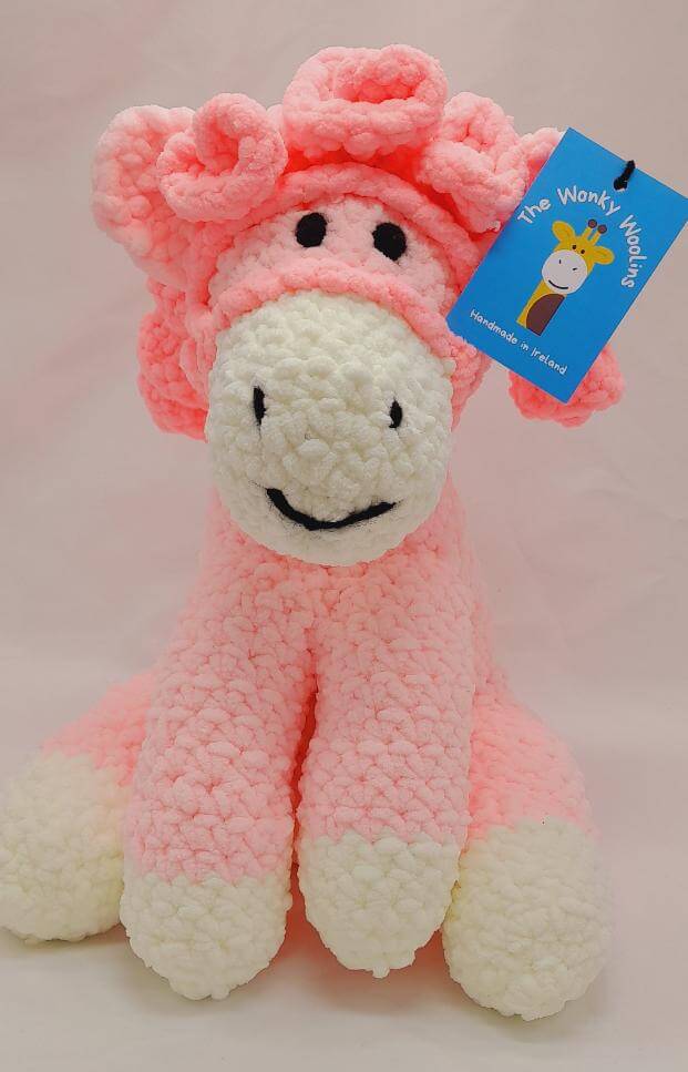 Pink pony stuffed toy with white nose and dark pink curly hair, unique baby gift for a toddler