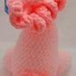 Pink pony stuffed toy with white nose and dark pink curly hair, unique baby gift for a toddler