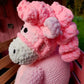 The best gift for a 1 year old baby girl. Pink pony stuffed toy with white nose and dark pink curly hair, unique baby gift for a toddler